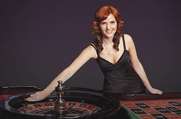 A live roulette croupier at an online casino.