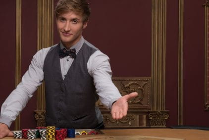 Casino Dealer Welcoming Players at a Card Table