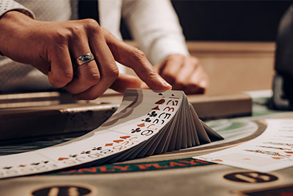 Cards being dealt at a land-based casino