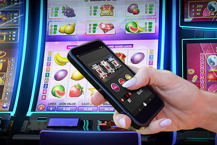 Mobile slot held in front of upright fruit machine