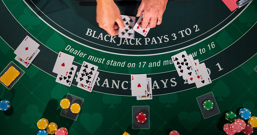 A blackjack table with playing cards lying on it