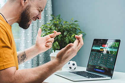 A man betting on a desktop computer