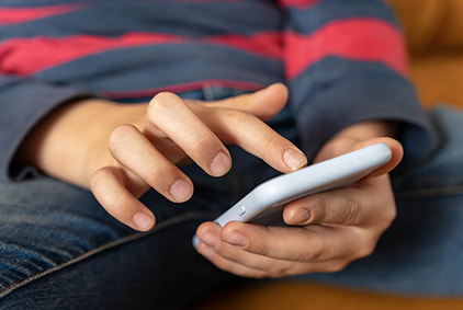 A child holding a smartphone