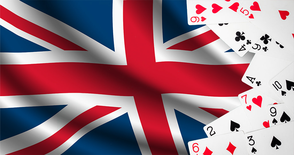 Gambling cards by the UK flag 