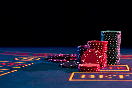 Gambling chips stacked on a betting table